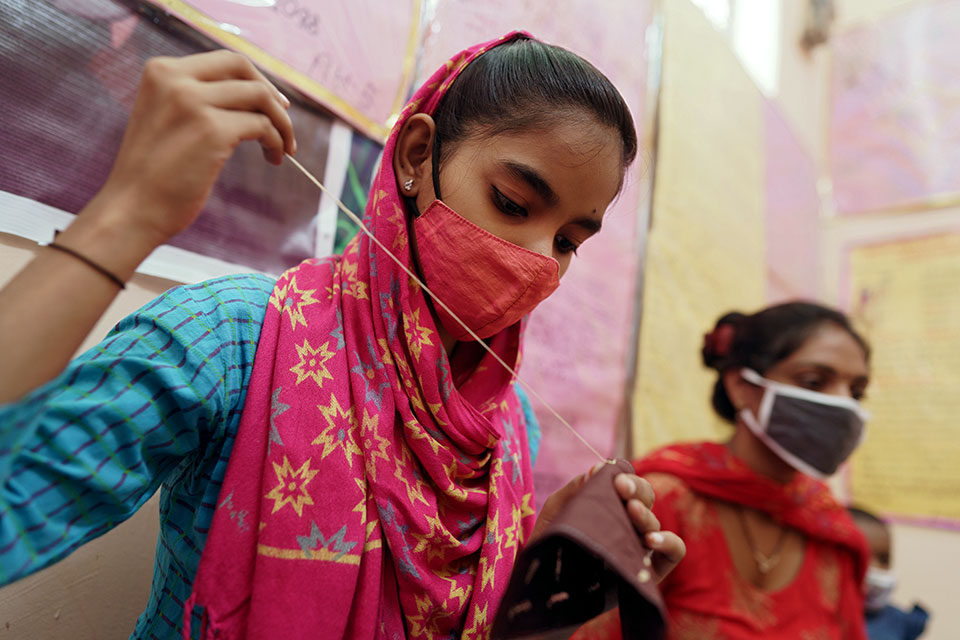 Eighteen-year-old Gulnaz learns tailoring at the SSK centre at Hatsal neighbourhood of New Delhi. She is on her way to becoming a skilled seamstress. She has finished her secondary education and will be teaching children in the community who cannot afford tuition. During the COVID lockdowns she helped children in her neighbourhood study at home. Photo: UN Women/Ruhani Kaur
