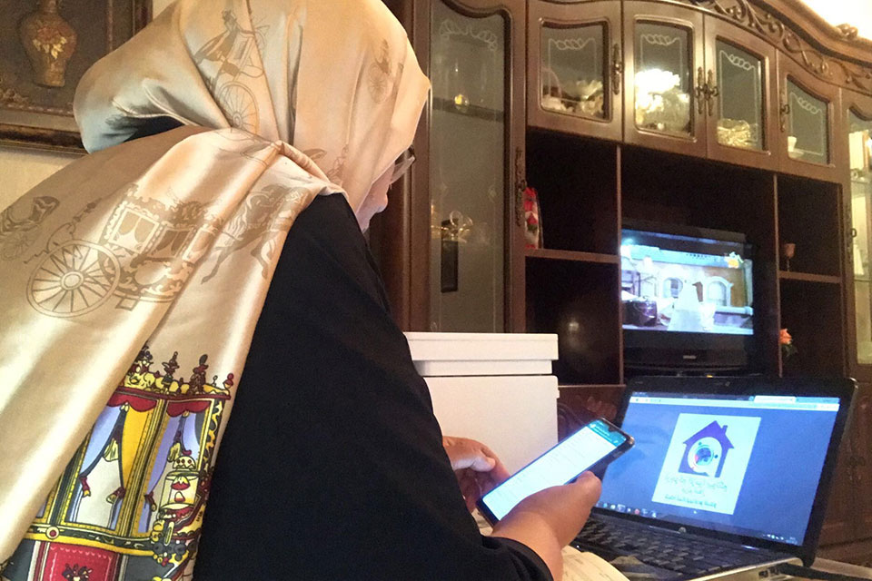 Women peacebuilders are using their mobile phones to support COVID-19 response efforts in Libya. Photos: Courtesy of Libyan Women’s Network for Peacebuilding.