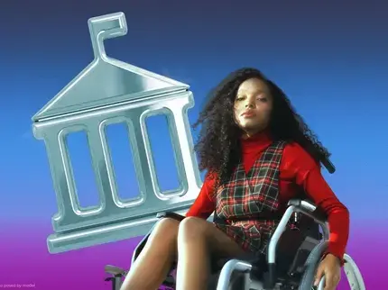 Portrait of a woman seated in a wheelchair against a blue-to-purple gradient background. She is wearing a red long-sleeve top under a plaid sleeveless dress. One hand rests on the arm of the wheelchair. Behind her is a large silver graphic of an institutional-style building with columns and a triangular roof. She is looking toward the camera with a neutral expression.