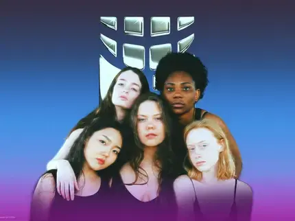 a group of women pose in front of the UN Women logo