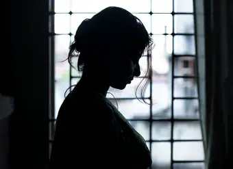profile view of woman in window frame