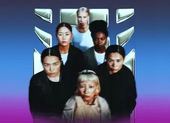 Six women standing closely together against a blue-to-purple gradient background, facing the camera with serious expressions. They are positioned in two rows, with a metallic UN Women logo displayed behind them. The women have diverse appearances and wear dark and neutral-toned clothing, creating a strong, unified group portrait.