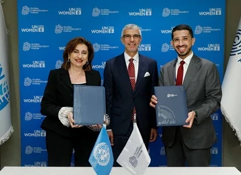After signing a partnership agreement between UN Women and the Global Cybersecurity Forum (GCF), UN Women Executive Director Sima Bahous and GCF CEO Abdurahman AlHassan stand for a photo with Abdulaziz M. Alwasil (centre), Permanent Representative of the Kingdom of Saudi Arabia to the United Nations. Photo: UN Women/Ryan Brown.