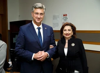 UN Women Executive Director Sima Bahous poses with the Prime Minister of Croatia at an indoor event.