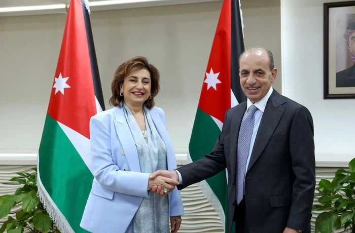 Sima Bahous and Walid Masri shake hands