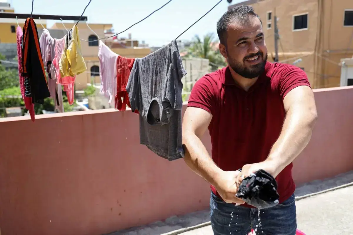 a father in Lebanon does the washing