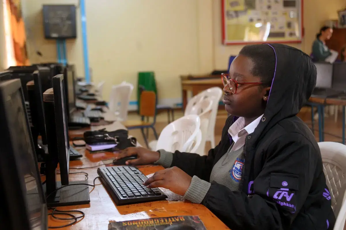 Patience Akongo working on the computer