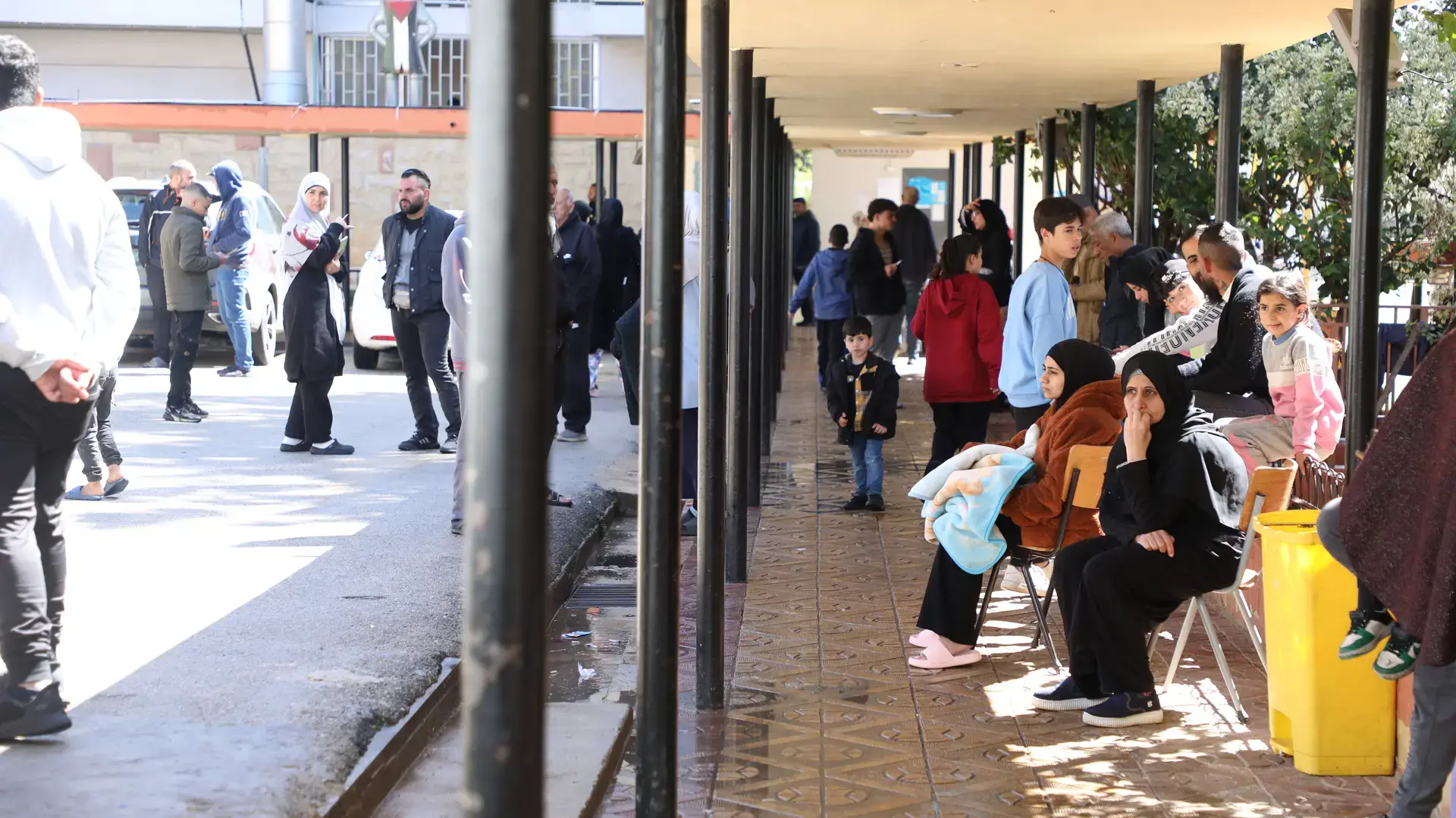 Displaced women and children shelter in a public space in Lebanon.