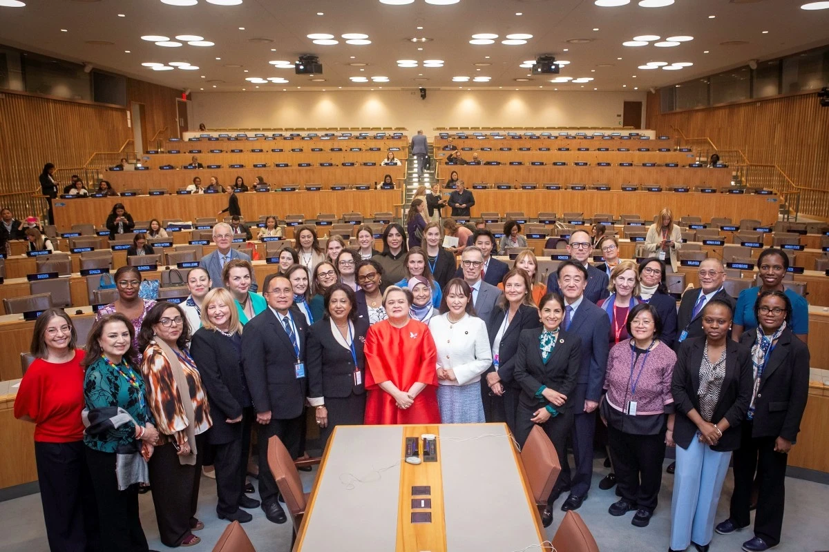 A group photo in a UN conference room