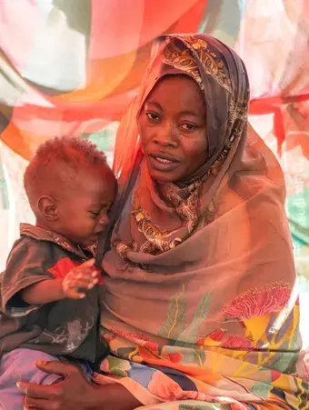 Rabha, a beneficiary of UN Women's humanitarian assistance at Saada and Salaam gathering site in Port Sudan. Through women-led organizations across the country, UN Women gives various forms of humanitarian support to the women and girls of Sudan including psychosocial, provision of dignity kits and sensitization on their rights. (Photo: UN Women/Ekram Hamad Fadlalla)