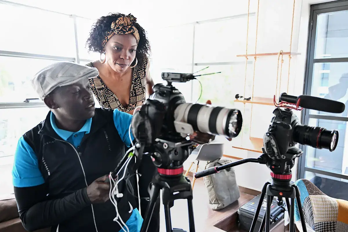 Adelle Onyango (in brown) interacts with a guest during a shoot for her Legally Clueless podcast in Nairobi. 