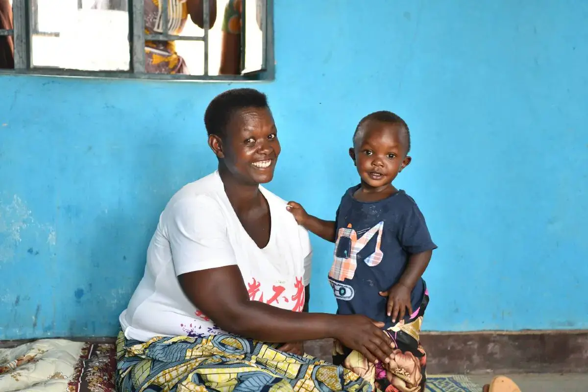 A woman in Rwanda with her youngest son