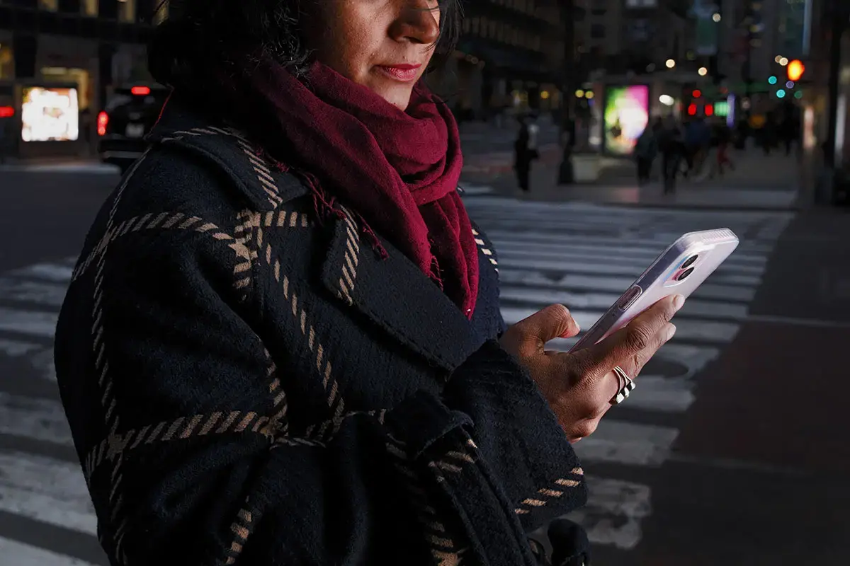 Technology-facilitated violence isn't just about what happens on screens. What happens online spills into real life easily and escalates. (Stock photo posed by model). Photo Illustration: UN Women/Ryan Brown.