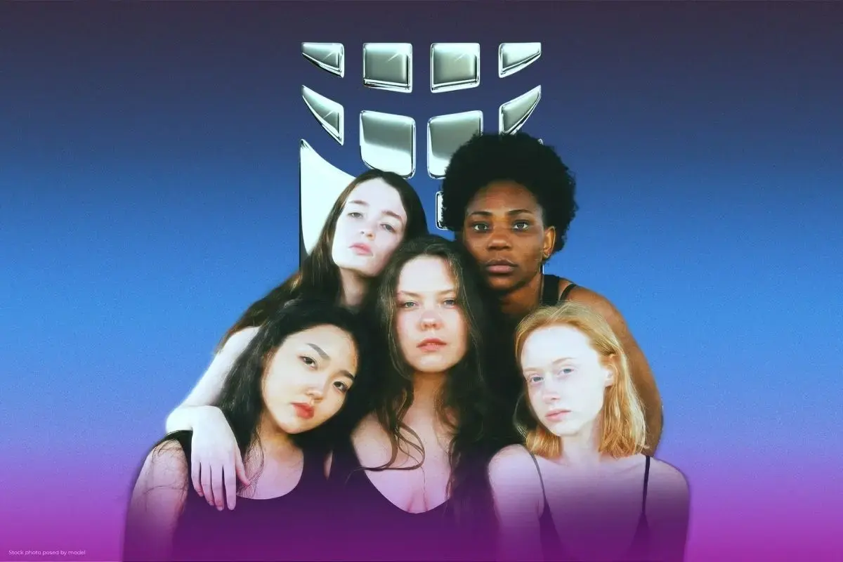 a group of women pose in front of the UN Women logo