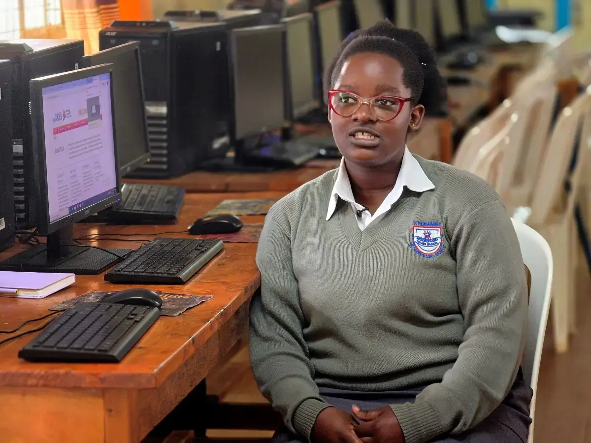 Patience Akongo gives an interview from her school's computer lab